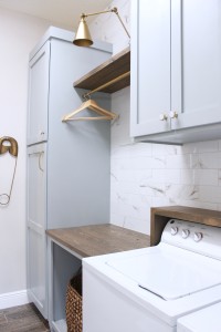 laundry room-diy-cabinets-painted-blue-marble-wall-tile-gold-sconce-light
