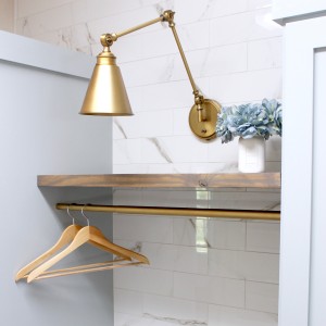 laundry room-gold-sconce-light-diy-marble-wall-tile-rustic-shelves